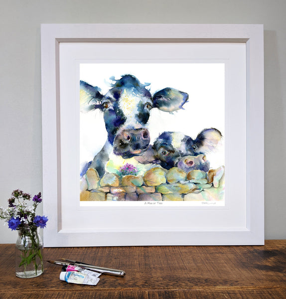 Black and White Cow Art Print in a white wood frame A Moo or Two designed by artist Sheila Gill