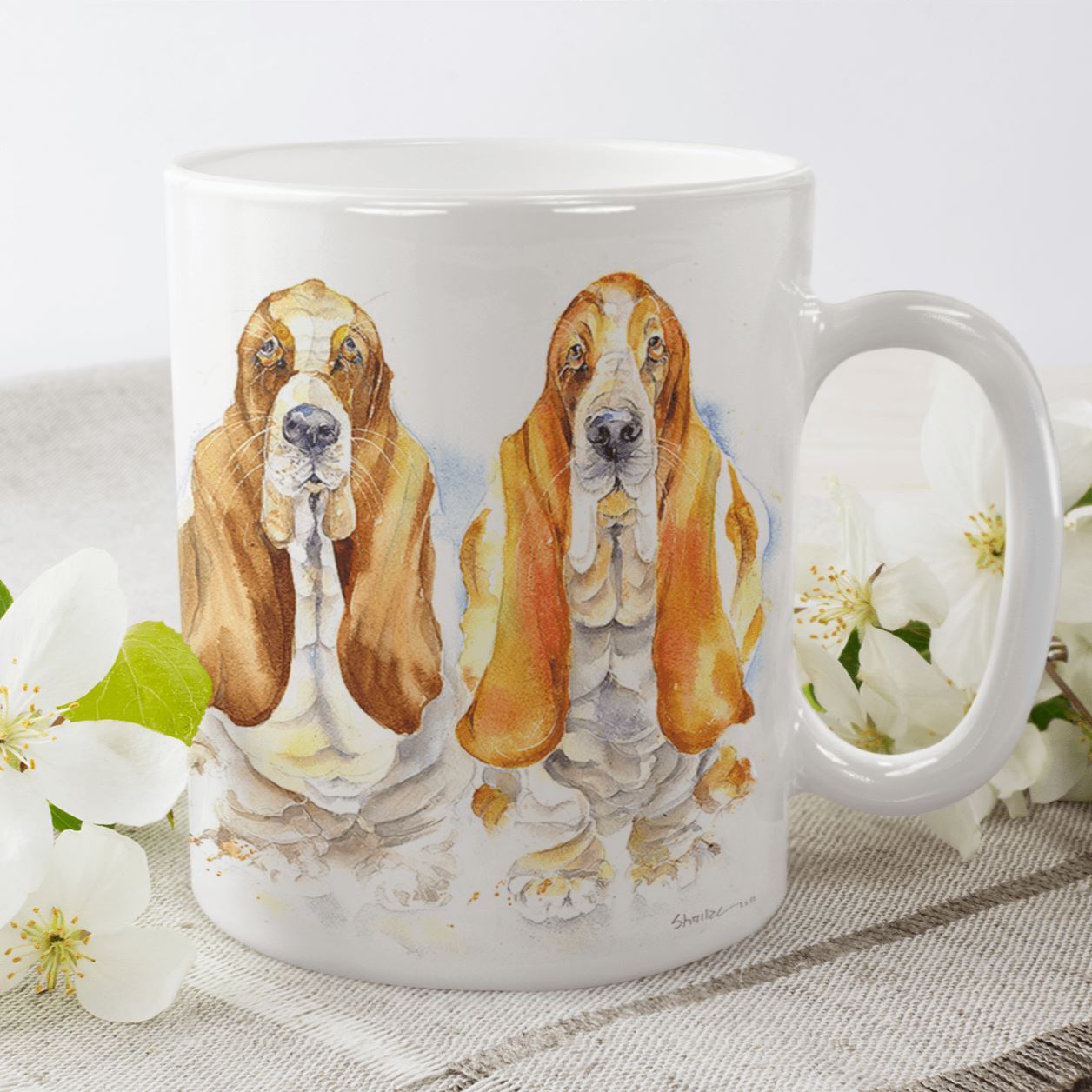 Two cute Basset Hound Dogs Ceramic Mug designed by artist Sheila Gill