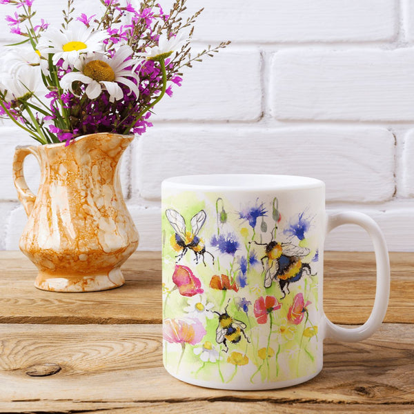 Buzzy Honey Bees In A Meadow Ceramic Mug designed by artist Sheila Gill